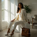Confident Woman in Elegant White Suit in Modern Office