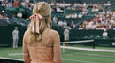 Spectator in Pink Dress Watching Tennis Match