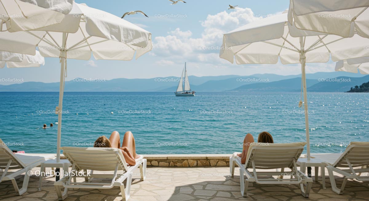 Serene Beachfront Relaxation with Sailboat on Horizon