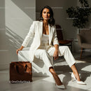 Confident Woman in Elegant White Suit in Modern Office