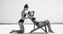 Two Women Relaxing by the Beach in Stylish Swimwear