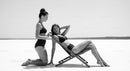 Monochrome Beach Elegance with Two Women Relaxing