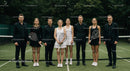 Group of Tennis Players Posing on Court in Uniform