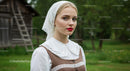 Young Woman in Traditional Lace Headscarf in Rural Setting