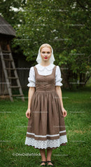 Woman in Traditional Dress in Green Countryside Setting