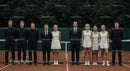 Tennis Team in Formal Attire on Clay Court