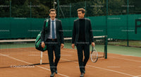 Businessmen Discuss Strategy on Tennis Court
