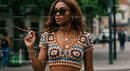 Confident Woman in Crochet Top with Sunglasses on City Street