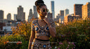Trendy Woman in Crochet Outfit Overlooking Urban Skyline