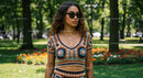 Woman in Crochet Outfit with Sunglasses in Park