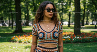 Woman in Crochet Outfit with Sunglasses in Park