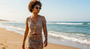 Fashionable Woman Walking on a Sunny Beach
