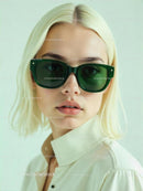 Blonde Woman in Green Sunglasses with Minimalistic Background