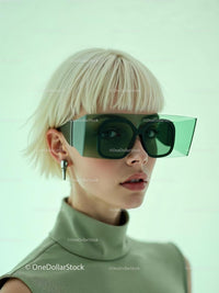 Fashion-Forward Portrait with Futuristic Green Sunglasses