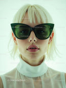 Blonde Woman in Stylish Green Sunglasses