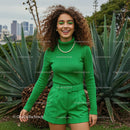 Joyful Woman in Green Outfit by Agave Plant
