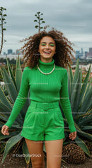 Woman in Bright Green Outfit Among Agave Plants