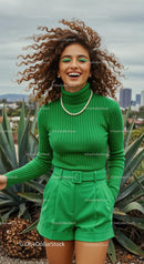 Smiling Woman in Green Outfit with Curly Hair Outdoors
