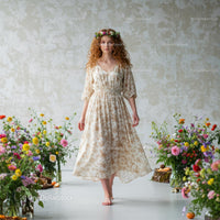 Model in Butterfly Wings on Floral Runway Show