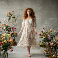 Red-Haired Woman in Floral Dress Among Blossoms