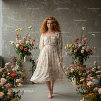 Redhead Woman in Floral Dress Among Blooming Flowers