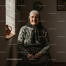 Elderly Woman in Cozy Room with Traditional Attire
