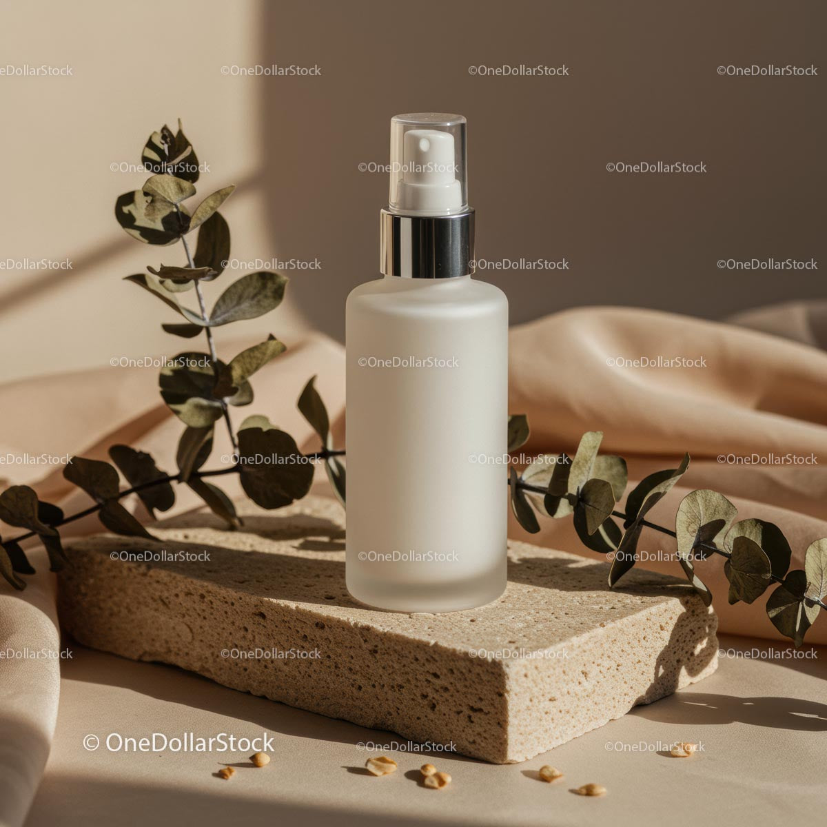 Minimalist Glass Bottle with Eucalyptus on Beige Background