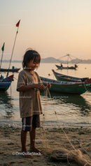 Young Fisherman at Sunset with Traditional Boats