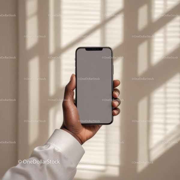Hand Holding Smartphone in Soft Sunlight JPG Mockup Image