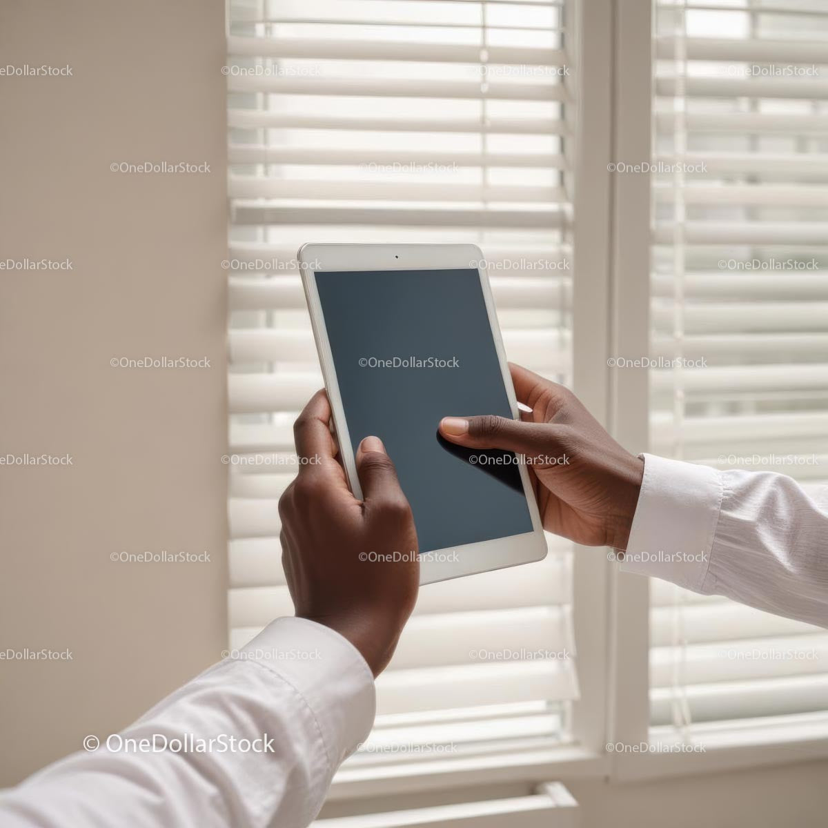 Person Holding Tablet Near Window Blinds