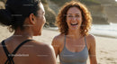 Joyful Women Sharing Laughter on a Sunny Beach