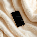 Smartphone on Cozy Beige Knitted Blanket