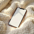 Smartphone with Blank Screen on Cozy Textured Blanket