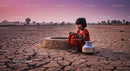 Young Girl in Red Dress on Arid Ground at Sunset