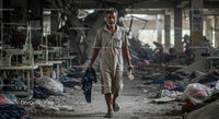 Worker Walking Through Abandoned Textile Factory