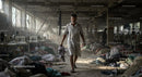Man Walking Through Abandoned Textile Factory