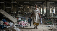 Desolate Garment Factory Interior with Lone Worker