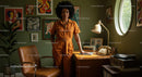 Stylish Woman in Retro-Inspired, Art-Filled Office