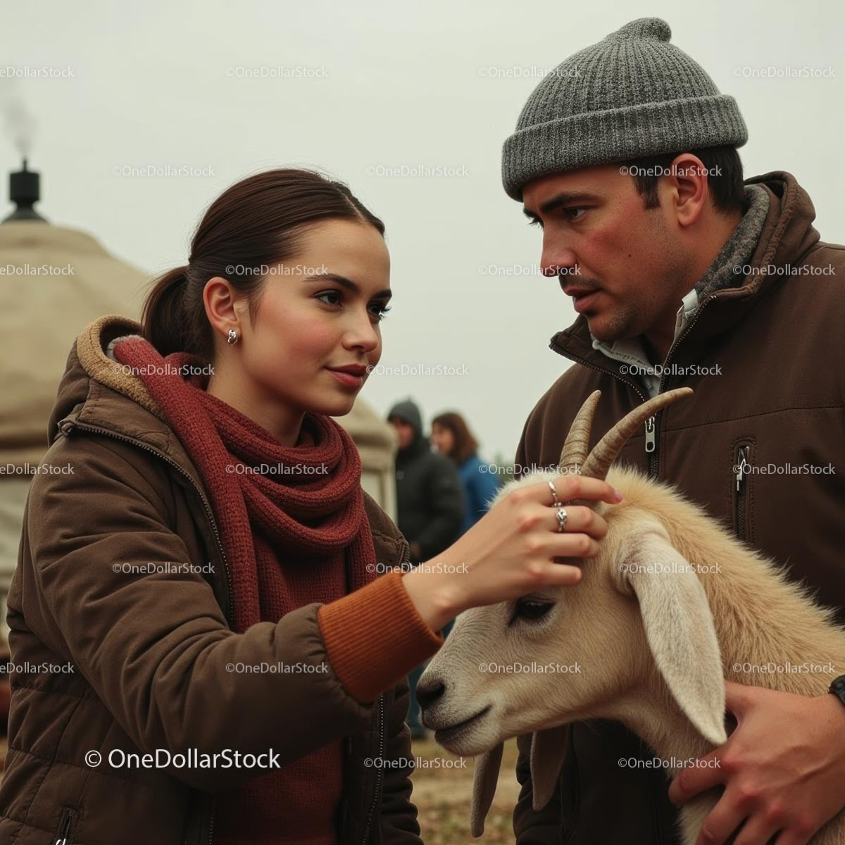 Young Couple Interacting with Goat in Rural Setting