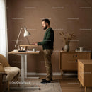 Man Working at a Standing Desk in a Stylish Home Office