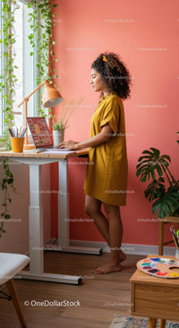Young Woman Working at a Standing Desk with Indoor Plants