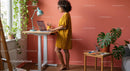 Woman Working at Standing Desk in Cozy Home Office