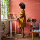 Woman in Yellow Dress Working at Standing Desk