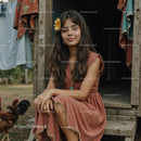 Young Woman with Yellow Flower in Rural Setting