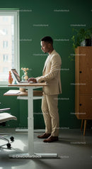 Professional Man Working at Standing Desk in Modern Office