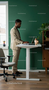 Professional Man Working at Standing Desk in Modern Office