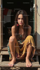 Young Woman in Floral Dress Relaxing on Outdoor Steps