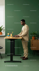 Business Professional Working at a Standing Desk with Plants