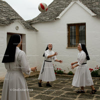 Nuns Enjoying a Playful Moment in Stone Courtyard