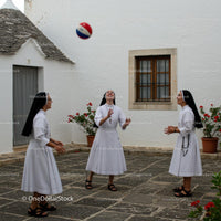 Nuns Enjoying a Game in a Courtyard Setting